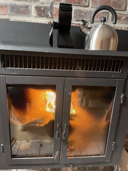 Can anybody help me identify this wood stove, or estimate its output/efficiency?
