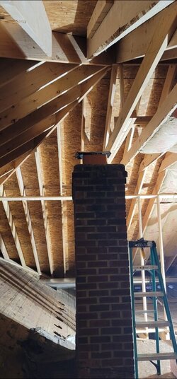 Solutions for chimney that was framed over during home addition build.