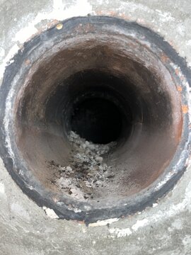 Liner, tee and wall pass through in masonry chimney.