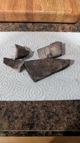 [Hearth.com] Can anybody identify this material from cleaning my drolet escape 1800 for the first time? Pretty sure it was sitting on the baffle.