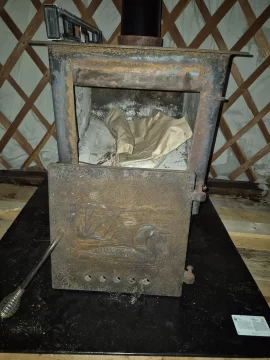 [Hearth.com] Old woodstove in yurt wall