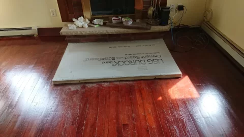 [Hearth.com] DYI Hearth pad - In order: 5/8" plywood, 1/2" Micore 300, 1/2" Durock, and ceramic tiles