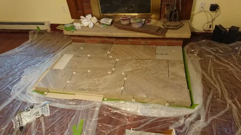 [Hearth.com] DYI Hearth pad - In order: 5/8" plywood, 1/2" Micore 300, 1/2" Durock, and ceramic tiles