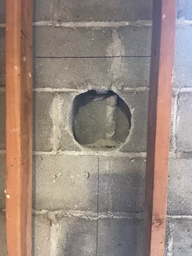 [Hearth.com] Chimney pipe through block should I fill the cavities with insulation?