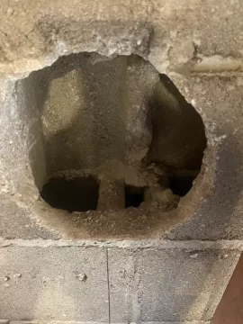 [Hearth.com] Chimney pipe through block should I fill the cavities with insulation?