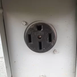 [Hearth.com] Outlet next to concrete pad. Purpose?