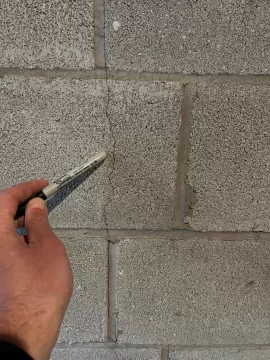 [Hearth.com] Hairline cracks in back of chimney.