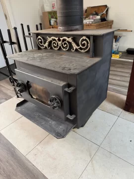 [Hearth.com] Step-top steel box stove ID — pinwheel draft caps + brass filigree