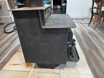 [Hearth.com] Step-top steel box stove ID — pinwheel draft caps + brass filigree