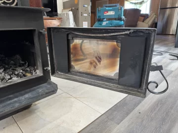 [Hearth.com] Step-top steel box stove ID — pinwheel draft caps + brass filigree