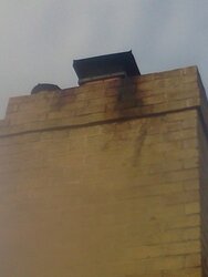 Chimney cap causing stain on exterior of chimney (PIC)