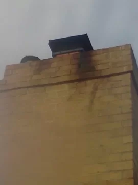 [Hearth.com] Chimney cap causing stain on exterior of chimney (PIC)