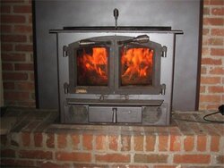 Free standing stove in fireplace - good or bad idea?
