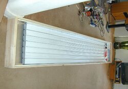 A standalone dual-pass solar air heater using downspouts