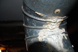 Is this ash leaking from vent pipe on my Oil Burning Furnace