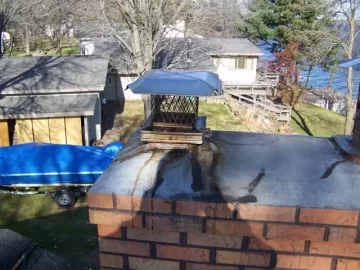 [Hearth.com] confused. flaky stuff on chimney cap.