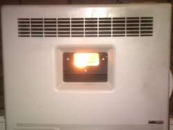 Window mount pellet stove