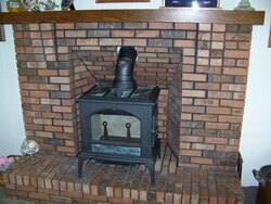 How does a raised hearth affect clearance requirements?