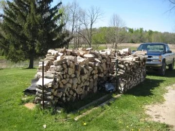 [Hearth.com] Adding to the wood pile puts a smile on my face!