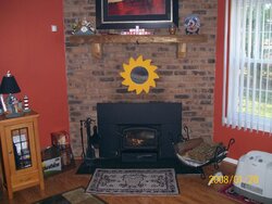 Whole house HVAC fan and wood burning insert