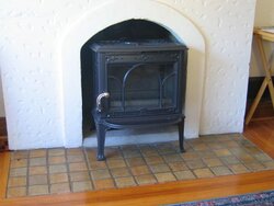 Can I partially insert a freestanding stove into the fireplace?