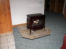 Anyone have pictures of a jotul oslo or other stove on a raised hearth