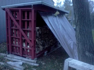 [Hearth.com] Wood shed loaded 2/3 of the way.