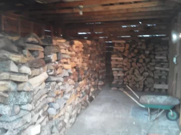 [Hearth.com] Wood shed loaded 2/3 of the way.