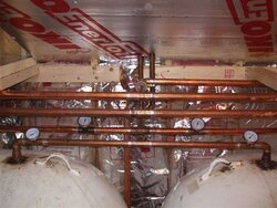 pressurized storage tank piping to the top with hot or to the bottom with hot?