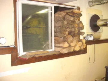 [Hearth.com] Bringing in another window full. A mix of wood.