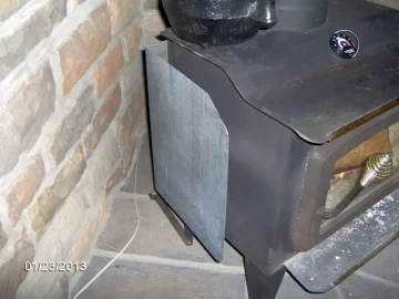 [Hearth.com] Heat shield mounted to wood stove