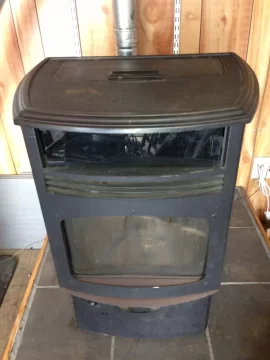 [Hearth.com] Quadrafire Contour Fire Pot swing plate loose.