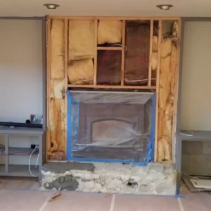 Fireplace with insulation behind the framing