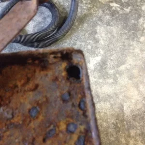 Hole in top where metal is rusted through