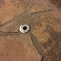 Metal piece to left of fireplace