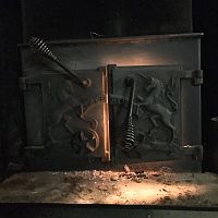 Lakewood wood stove with unicorns on doors