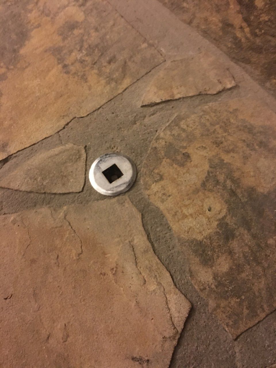 Metal piece to left of fireplace