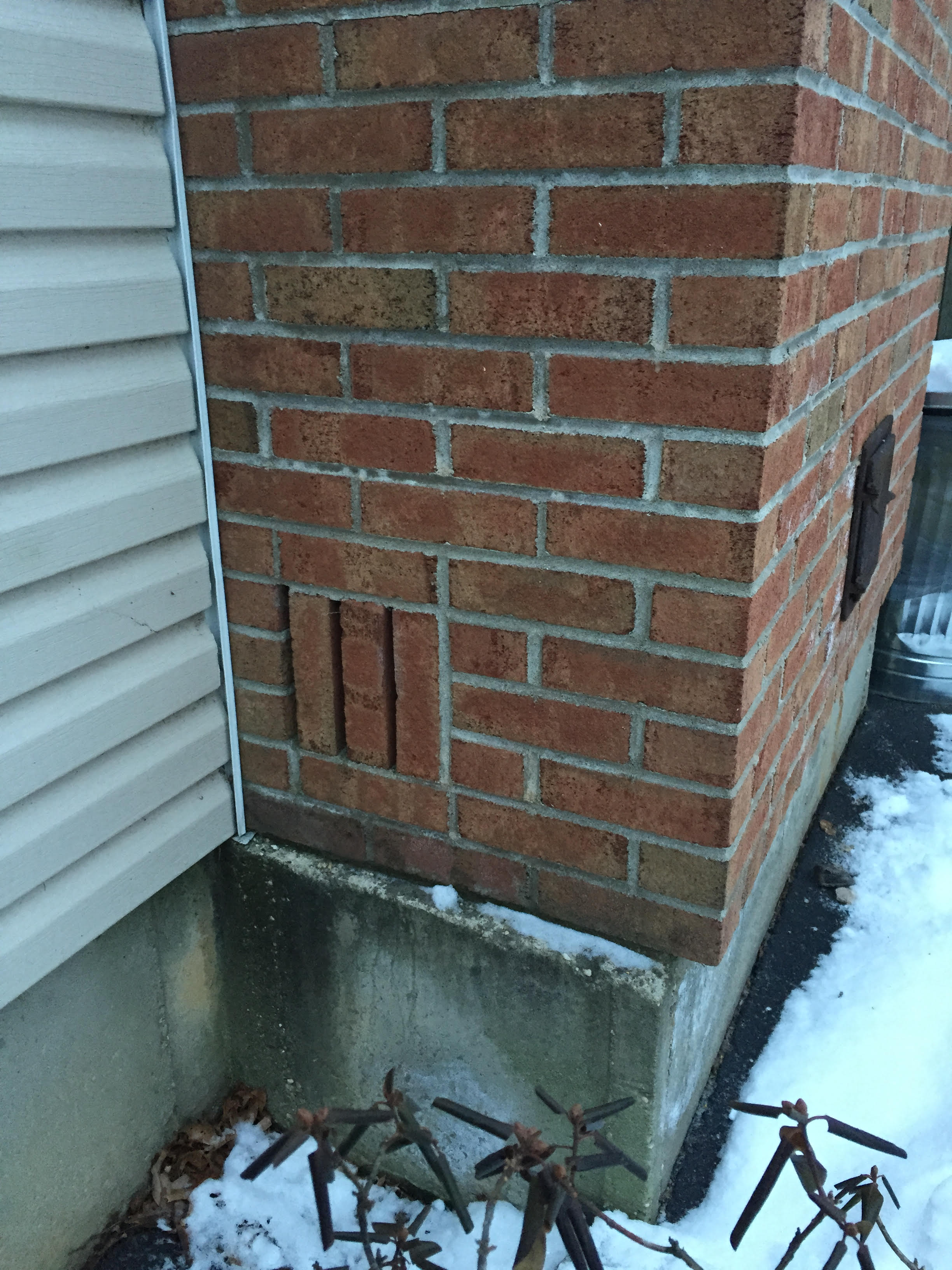 Need help identifying these vertical bricks on my chimney