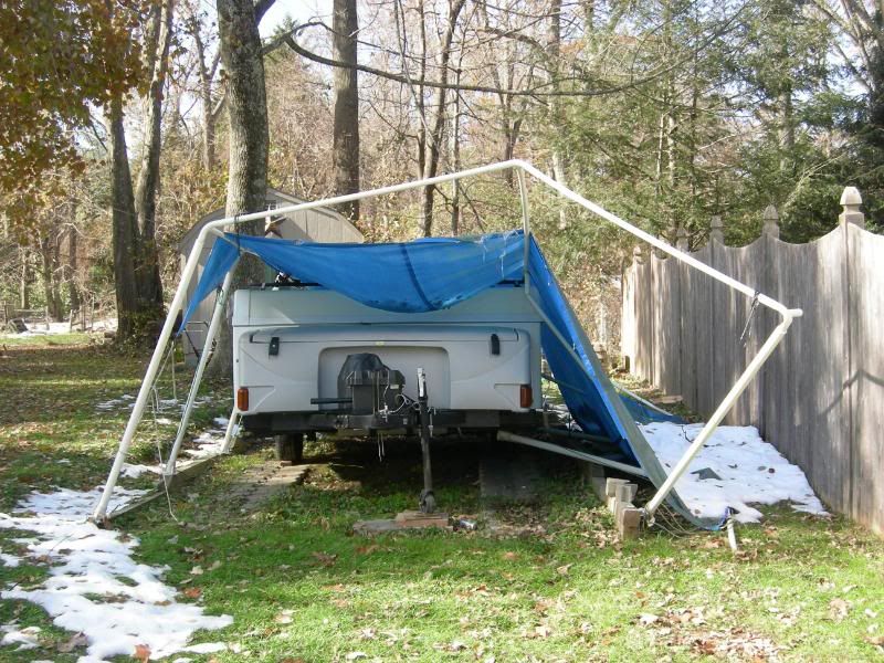 Carport woodshed.